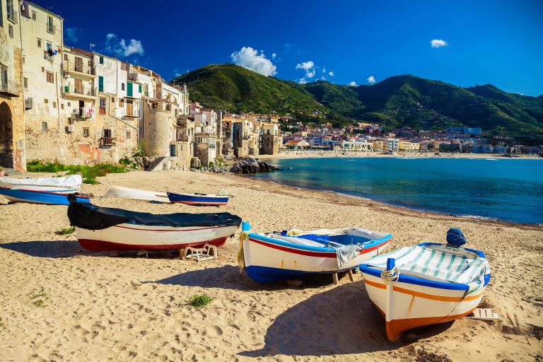old wooden fishing boats on the beach of Cefalu