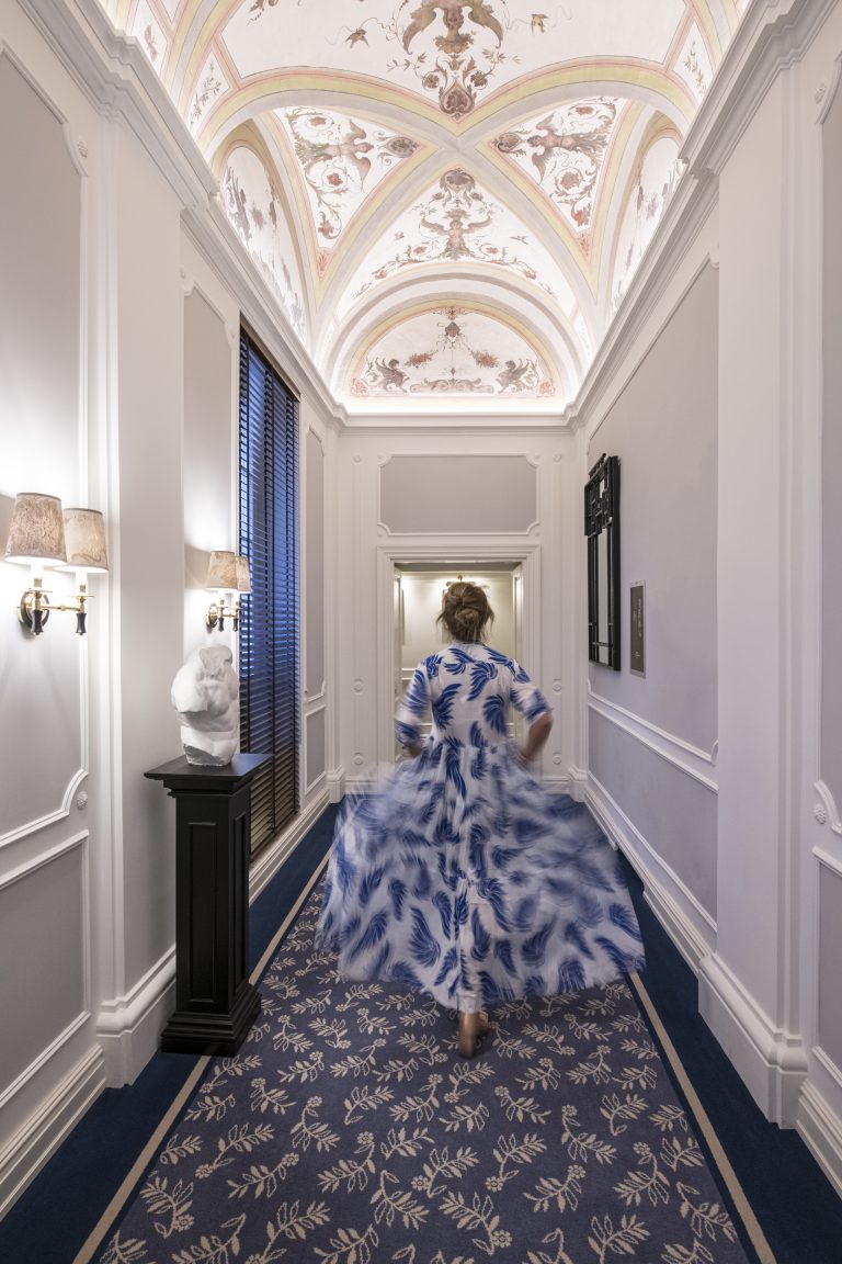 Wolking in the passage way of the first floor at Hotel Maalot in Rome